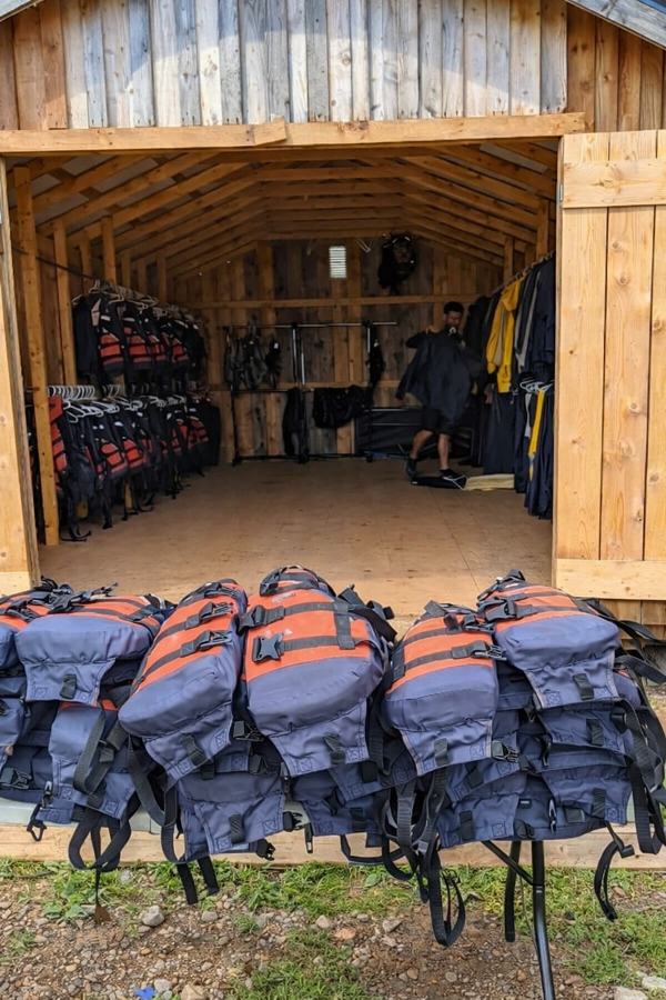 Life jackets and rafting gear prepared for tidal bore rafting tours on the Shubenacadie River in Nova Scotia