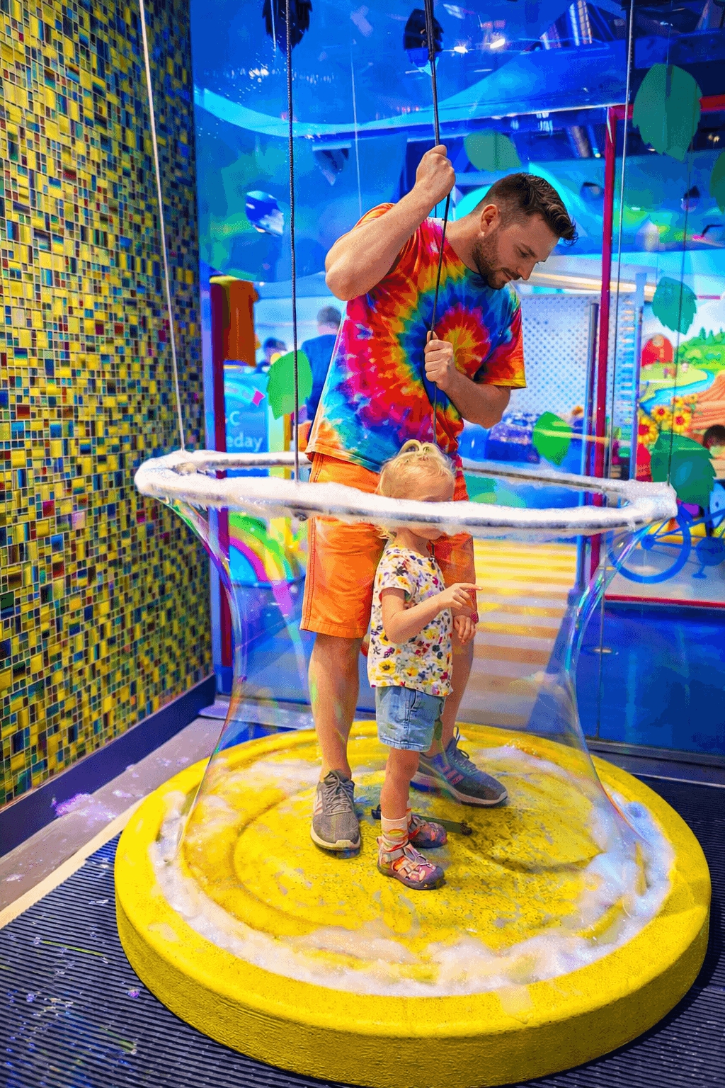 Child standing inside a giant bubble exhibit at the Discovery Centre in Halifax