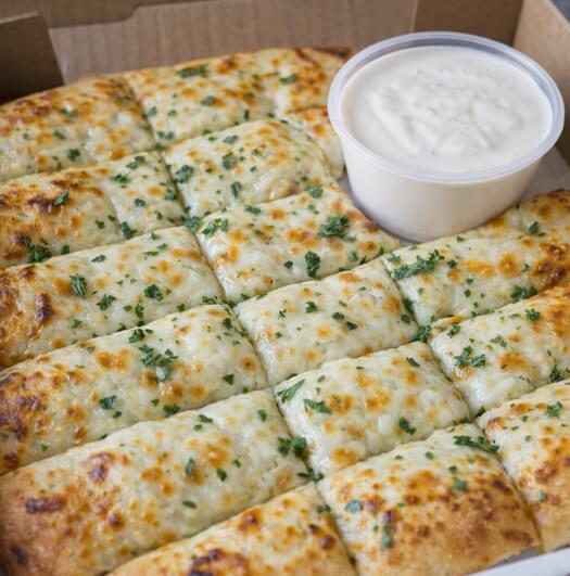 Garlic fingers with dipping sauce from Magic Pizza near Windsor Nova Scotia popular local takeout