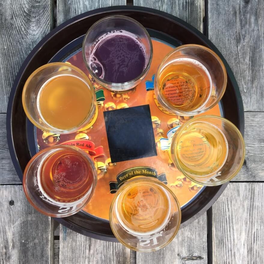 Craft beer tasting flight served at The Port Pub overlooking the Minas Basin in Port Williams, Nova Scotia